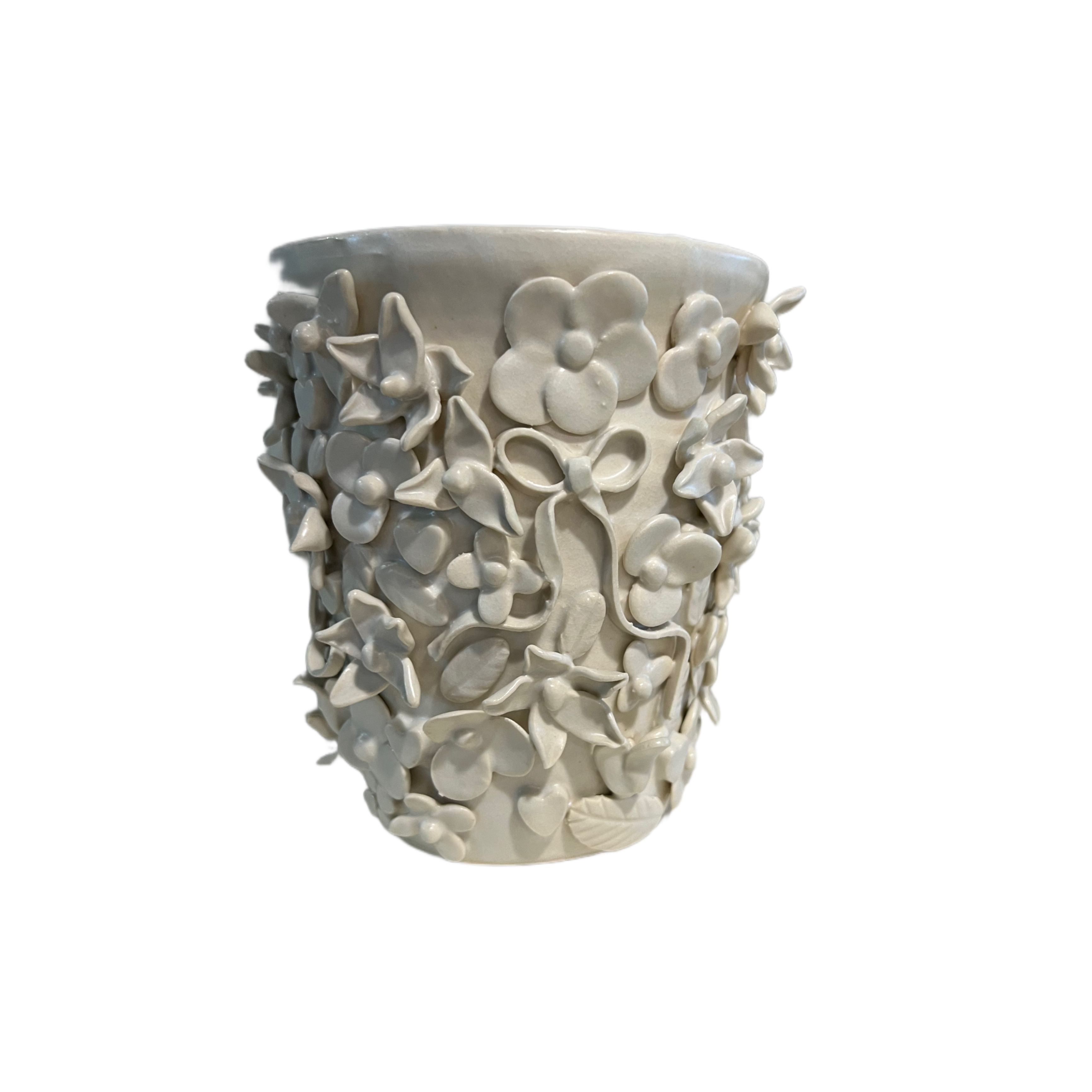 White porcelain vessel covered in dimensional floral appliques