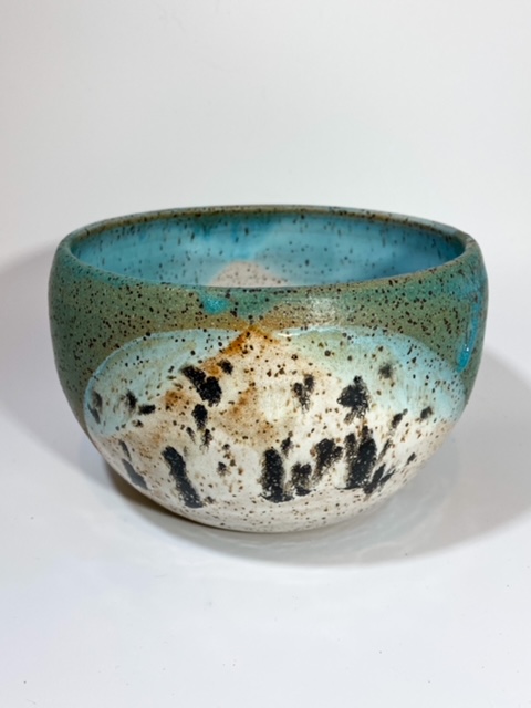 Speckled ceramic bowl with blue glaze
