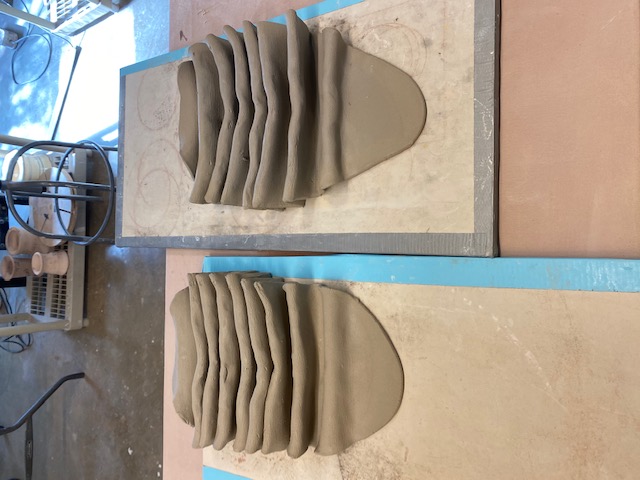 Ceramic works in progress on a studio surface